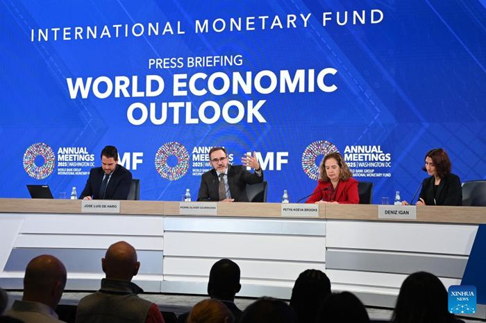 The International Monetary Fund (IMF) chief economist Pierre-Olivier Gourinchas (2nd L) speaks at a press briefing on World Economic Outlook in Washington, D.C., the United States, Oct. 14, 2025. IMF on Tuesday raised its global economic growth for 2025 to 3.2 percent, 0.2 percentage point higher than the July forecast, the latest World Economic Outlook report said. (Photo: Xinhua)