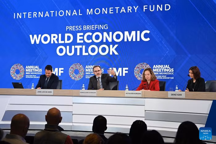 The International Monetary Fund (IMF) chief economist Pierre-Olivier Gourinchas (2nd L) speaks at a press briefing on World Economic Outlook in Washington, D.C., the United States, Oct. 14, 2025. IMF on Tuesday raised its global economic growth for 2025 to 3.2 percent, 0.2 percentage point higher than the July forecast, the latest World Economic Outlook report said. (Photo: Xinhua)