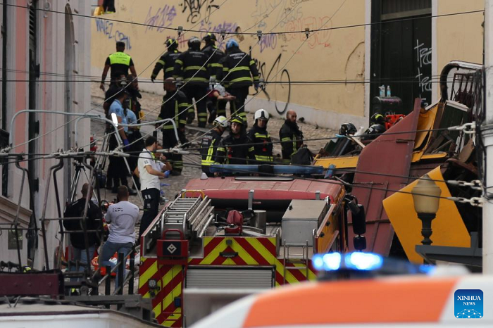Firefighters and Public Security Police work on the site of the funicular accident in Lisbon, Portugal, on Sept. 3, 2025. The Gloria Funicular, one of Lisbon's best-known tourist attractions, derailed and overturned on Wednesday evening, leaving 15 people dead and 18 others injured, including five in serious condition, local media reported, citing police sources. (Photo: Xinhua)
