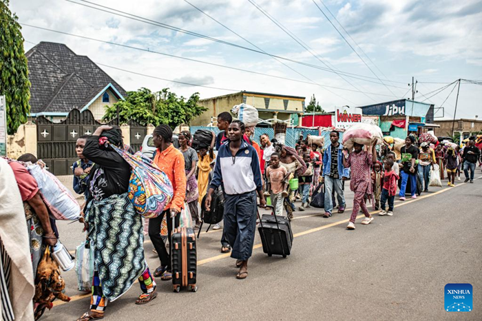 Displaced people from the Democratic Republic of the Congo (DRC) are seen in the town of Bugarama in neighboring Rwanda, on Dec. 5, 2025. The March 23 Movement (M23) rebels have expanded their operations across several areas of South Kivu Province in eastern Democratic Republic of the Congo (DRC) over the past days, even as the DRC and Rwanda signed in Washington a peace deal hailed as a major step toward de-escalation in the region. Residents in the affected areas reported a FARDC pullback and the displacement of civilians fleeing the new combat zones. Hundreds of families have arrived in Uvira, while others from Kamanyola, a strategic crossroad in the province, crossed into Rwanda to escape shellfire. (Photo: Xinhua)