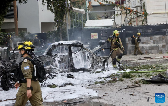 Israeli security and rescue forces work at the site of an Iranian strike in Tel Aviv, Israel, March 15, 2026. The U.S.-Israel-Iran conflict entered its 16th day on Sunday. (Photo: Xinhua)