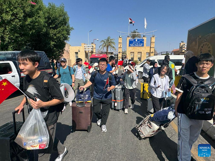 Chinese citizens evacuated from Israel are pictured at the Taba border crossing in Egypt's South Sinai province, June 19, 2025. One hundred and nineteen Chinese citizens were evacuated from Israel to Egypt on Thursday through the Taba border crossing in Egypt's South Sinai province. (Photo: Xinhua) 