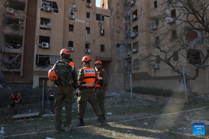 People work at the site of a missile strike in Be'er Sheva, Israel, on March 2, 2026. A missile from Iran struck a residential area in the southern Israeli city of Be'er Sheva on Monday, injuring at least 15 people, according to Israeli authorities. (Photo: Xinhua)