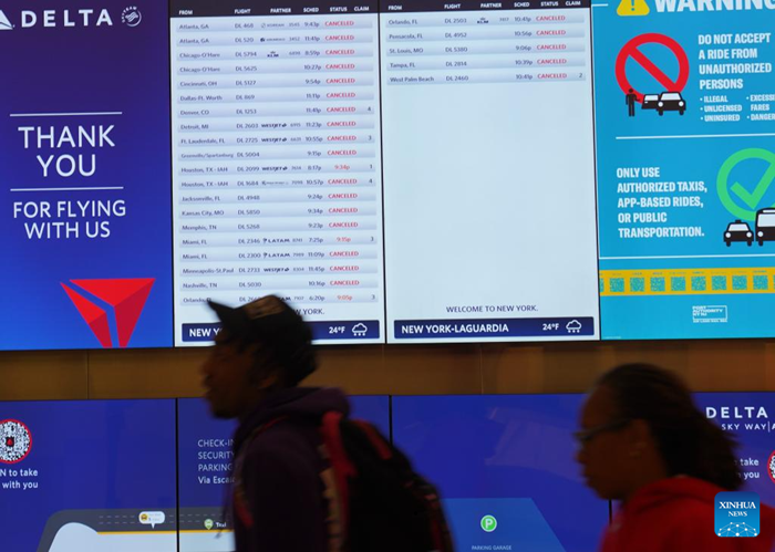 A screen shows many flights cancelled due to a snowstorm at LaGuardia Airport in New York, the United States, on Dec. 26, 2025. A snowstorm hitting New York on Friday, which has caused flight delays and cancellations. (Photo: Xinhua)