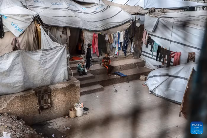Displaced Palestinian children are pictured in a school-turned shelter in the center of Gaza City, April 5, 2026. Hamas rejected on Sunday the discussion of disarmament before the completion of the first phase of the ceasefire agreement in the Gaza Strip. (Photo: Xinhua)