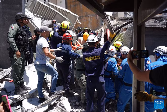 Rescuers work at a collapsed building after an earthquake in the city of Manizales, Colombia, Aug. 10, 2026. The death toll from a magnitude 7.4 earthquake that struck western Colombia on Monday has risen to 132, with more than 570 others injured, the Colombian government said in its latest update. (COLPRENSA/Handout via Xinhua)