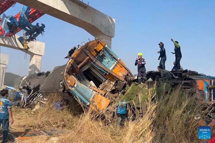 This photo taken with a phone on Jan. 14, 2026 shows the accident site after a crane collapse derailed a passenger train in Sikhio District, Thailand's Nakhon Ratchasima Province. At least 22 people were killed and 55 others injured after a passenger train collided with a collapsed construction crane in northeastern Thailand's Nakhon Ratchasima province on Wednesday, local media reported. (Xinhua)