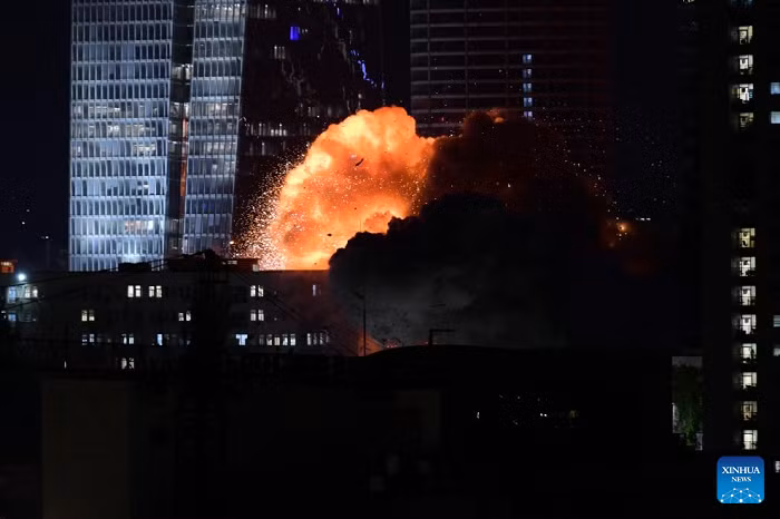 A building is hit by a missile in Tel Aviv, Israel, on June 13, 2025. Nearly 100 missiles were launched from Iran toward central and northern Israel in two massive barrages, causing significant damage and injuring 41 people, according to the Israeli military and the national emergency service, Magen David Adom (MDA). (Tomer Neuberg/JINI via Xinhua)