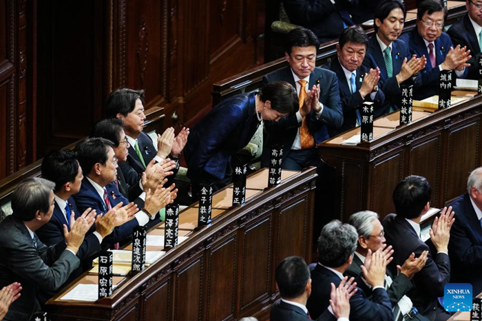 Takaichi Sanae (C) bows after winning Japan's prime ministerial designation vote in the House of Representatives in Tokyo, Japan, Feb. 18, 2026. Takaichi Sanae, president of Japan's ruling Liberal Democratic Party, was elected as the country's 105th prime minister on Wednesday by lawmakers in parliament. (Photo: Xinhua)
