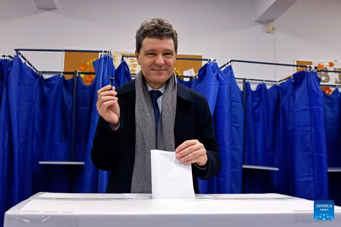 Romanian President Nicusor Dan votes during a local election at a polling station in Bucharest, Romania, on Dec. 7, 2025. Bucharest's citizens on Sunday vote in a local mayoral election after the former mayor Nicusor Dan was elected as Romanian president in May. (Photo: Xinhua)