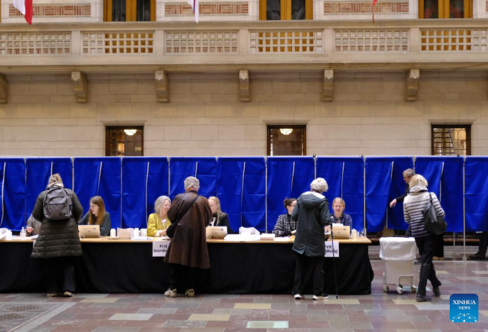 Voters collect ballot papers at the City Hall in Copenhagen, Denmark, on March 24, 2026. Denmark's ruling Social Democrats remained the largest party in Tuesday's parliamentary election, according to preliminary official results based on vote counts in metropolitan Denmark, while counting in Greenland and the Faroe Islands is still ongoing. (Photo: Xinhua)