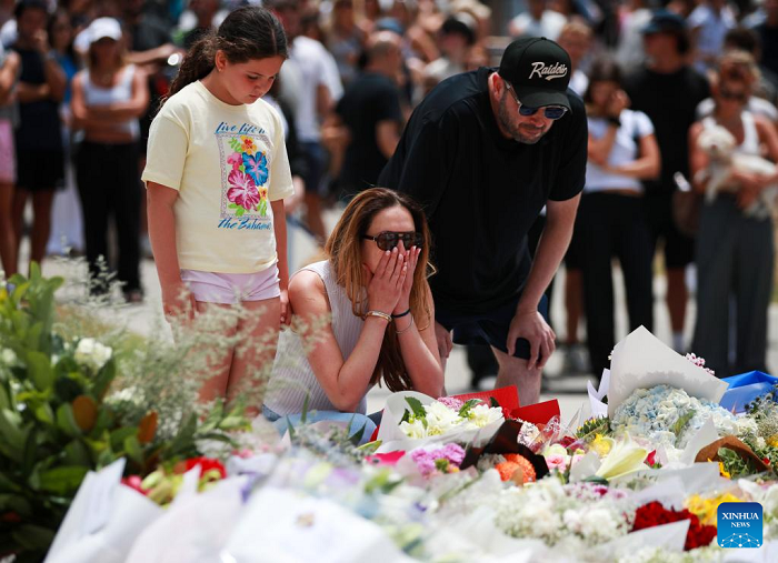People mourn the victims of the Bondi Beach shooting in Sydney, Australia, Dec. 15, 2025. The death toll from a shooting at Sydney's Bondi Beach on Sunday has risen to 16, with a father and son identified as the attackers, police said Monday. (Photo: Xinhua)
