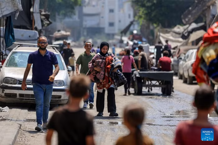Palestinians fleeing to south Gaza Strip are seen on a road in Gaza City, on Aug. 22, 2025. Israeli forces have been besieging the densely populated Gaza City for about two weeks from several directions. Israeli officials said that evacuation notices would be issued to Palestinians there before the army moves in, according to Palestinian security sources. (Photo: Xinhua)