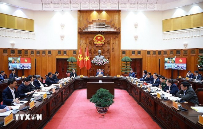Prime Minister Pham Minh Chinh presides over a meeting between the Government’s standing members and ministries, sectors and localities on December 16 on preparations for the groundbreaking, inauguration, and technical opening ceremonies of key projects (Photo: VNA)