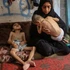 Two displaced Palestinian children suffering from malnutrition and cerebral palsy are seen inside a school-turned shelter in the northwest of Gaza City, July 25, 2025. (Photo: Xinhua)