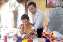 Ensuring employment for persons with disabilities is widely seen as one of the most effective ways to help them integrate into the community quickly and sustainably. (Photo: nhandan.vn)