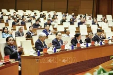 Politburo member, Secretary of the NA Party Committee and NA Chairman Tran Thanh Man (front, centre) and other officials at the briefing on the 14th National Party Congress's outcomes on January 26. (Photo: VNA)