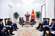 The meeting between Permanent Deputy Minister of Foreign Affairs Nguyen Minh Vu (right) and the delegation of the New Azerbaijan Party in Ha Noi on January 26. (Photo: Ministry of Foreign Affair)