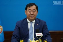 Sous Yara, Spokesperson and First Vice Chairman of the CPP's External Relations Commission speaks to a reporter from Nhan Dan newspaper based in Cambodia. (Photo: DINH TRUONG)