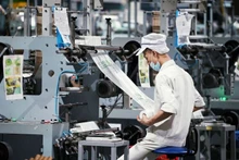Gradual removal of bottlenecks creates momentum for effective private sector development. (Photo: nhandan.vn)
