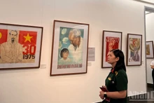 Visitors at an exhibition at the Viet Nam Museum of Fine Arts. (Photo: nhandan.vn)