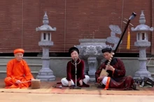 Meritorious Artisan Phuong Hong (centre) performing ca tru at Dac So communal house, Ha Noi. (Photo courtesy of the character)