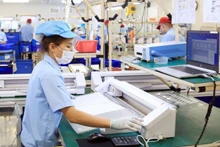 Production of electronic components at Rhythm Precision Viet Nam Co., Ltd. in Noi Bai Industrial Park, Ha Noi. (Photo: NGUYEN QUANG)