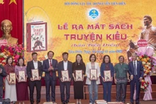 The Nguyen Tien Dien family council presents books to schools at the launch of The Tale of Kieu – Tien Dien Edition.