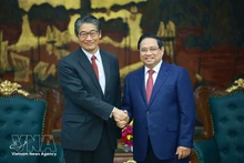 Prime Minister Pham Minh Chinh (right) receives Japanese Ambassador to Viet Nam Ito Naoki on March 17. (Photo: VNA)