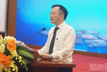 Dr Ha Khac Minh, Editor-in-Chief of the Corporate Finance Magazine, speaking at the event. (Photo: TRUNG HUNG)