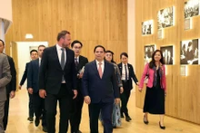 Prime Minister Pham Minh Chinh (front, first from right) and officials visit the Arvo Pärt Centre on June 6. (Photo: VNA)