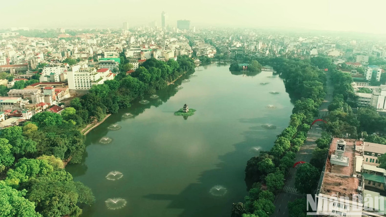 Thap rua (Turtle Tower) is located in the middle of a green area in the city. Thap rua (Turtle Tower) is located in the middle of a green area in the city.