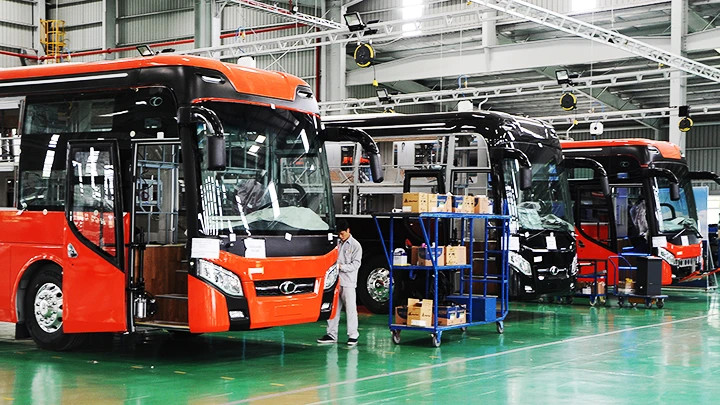 Workers assemble buses at THACO Truong Hai Automobile Factory. Photo: BAC SON
