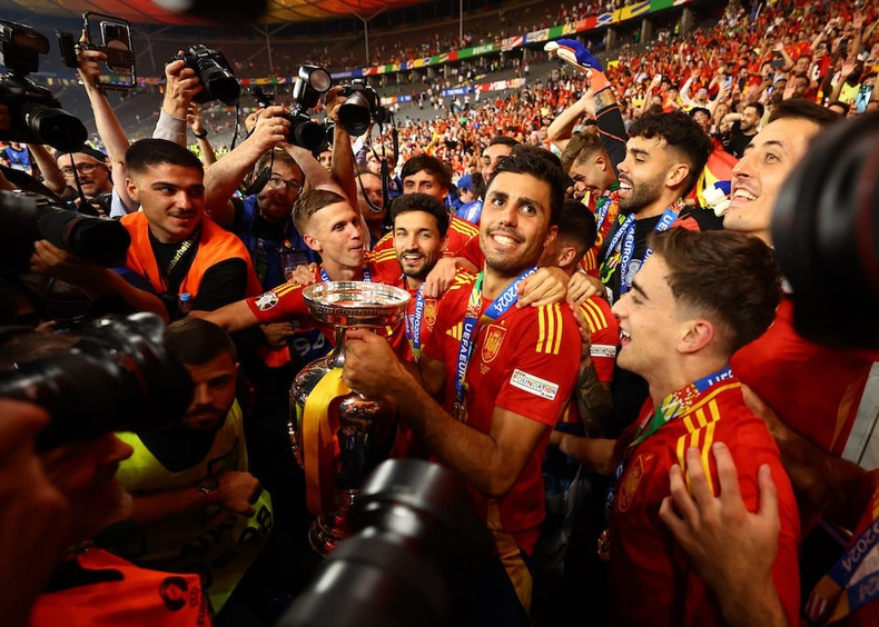 Rodri, Jesus Navas, Dani Olmo, and other teammates celebrate as the new champions. Rodri, Jesus Navas, Dani Olmo, and other teammates celebrate as the new champions.