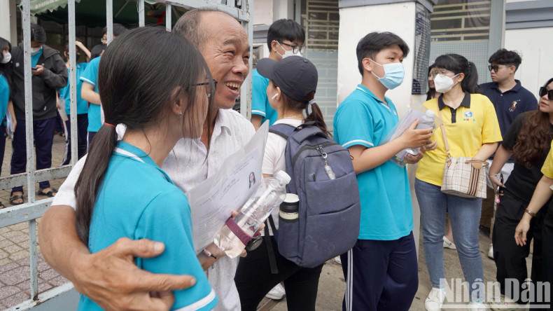 A candidate’s father expresses his joy after 120 minutes of waiting for his daughter to take the first test. A candidate’s father expresses his joy after 120 minutes of waiting for his daughter to take the first test.