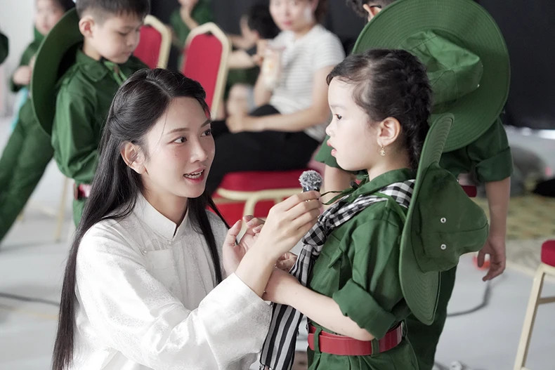 Young artists and child singers during the production of the music video.
