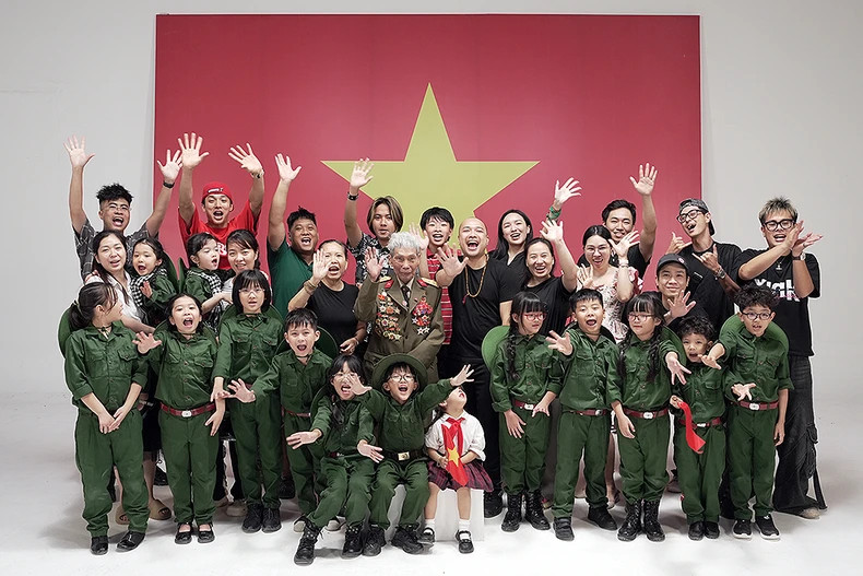 The music video is produced against the backdrop of the Vietnamese national flag.