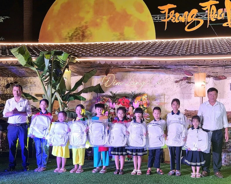 Gifts are given to children as they prepare for the new school year.