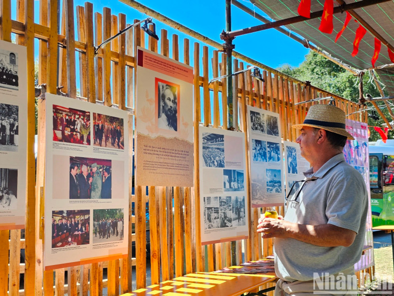 International friends spend considerable time viewing the images and famous quotes of President Ho Chi Minh.