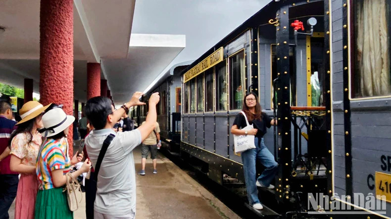 Tourists take photos at the Da Lat Railway Station.