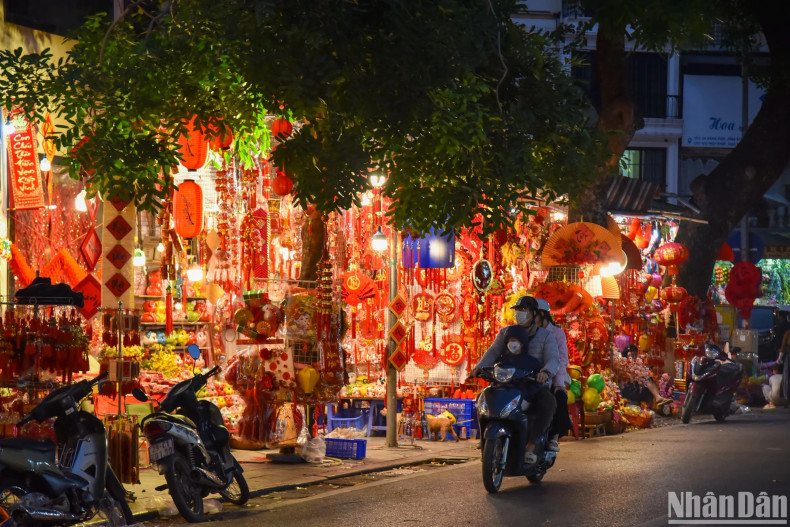 The street is flooded with red and yellow colours, which symbolise luck and prosperity, signalling the Lunar New Year. The street is flooded with red and yellow colours, which symbolise luck and prosperity, signalling the Lunar New Year.