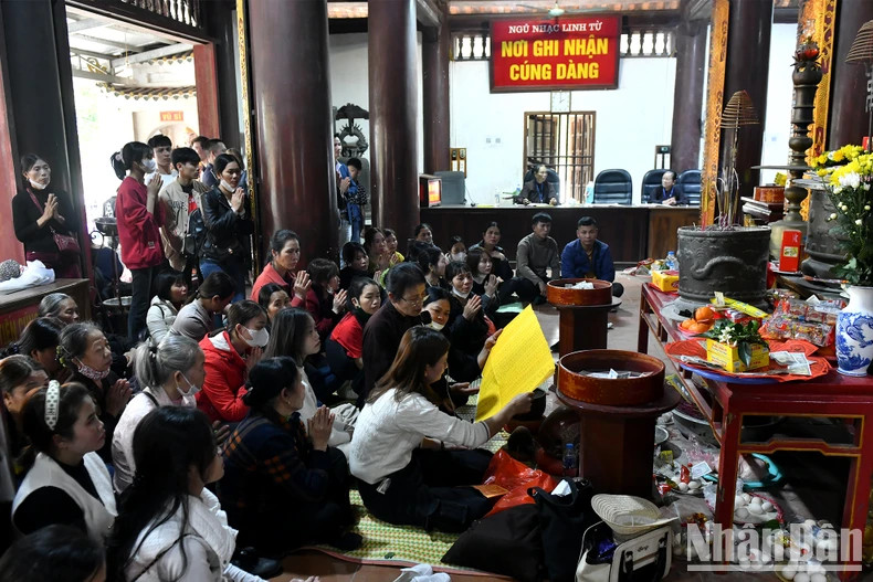 Buddhists and pilgrims respectfully pay homage to Buddha.