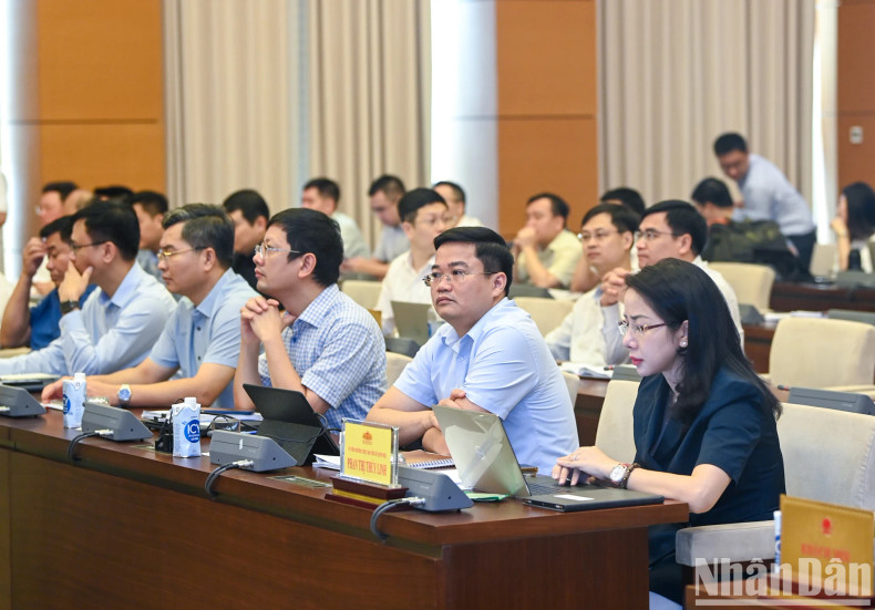 The delegates attend the session.