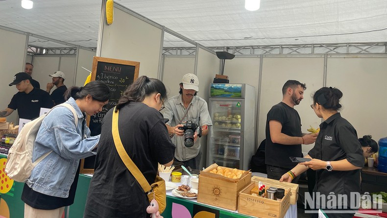 Visitors enjoy street food dishes prepared by renowned restaurants from both countries.