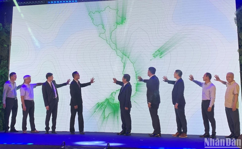 The delegates press the button to launch the national park passport initiative.