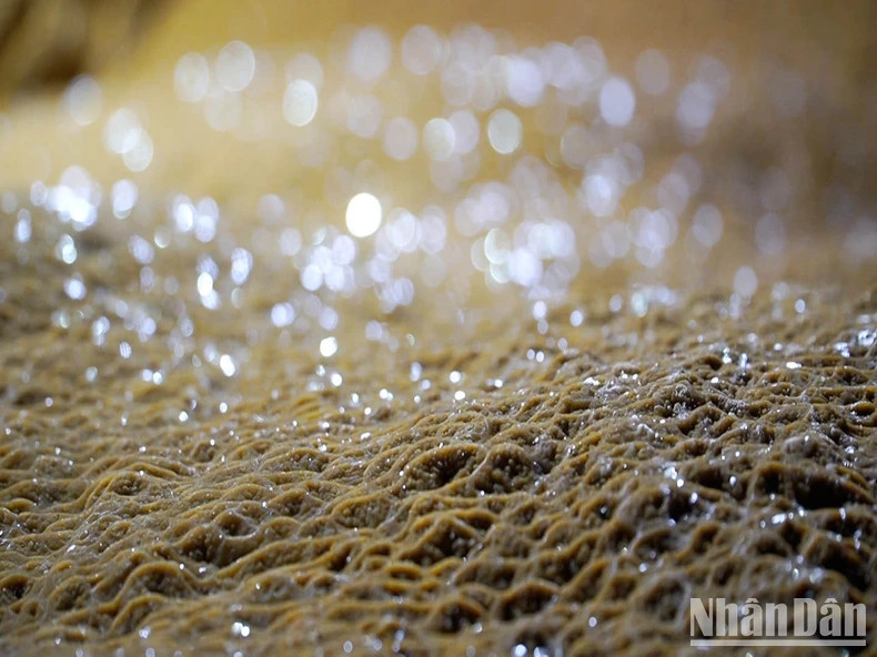 The yellow stalactites in the cave.