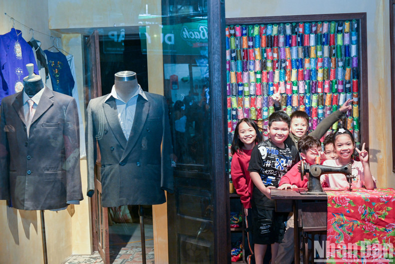 Many children are delighted with the sewing machine and fabric featuring a peacock design.