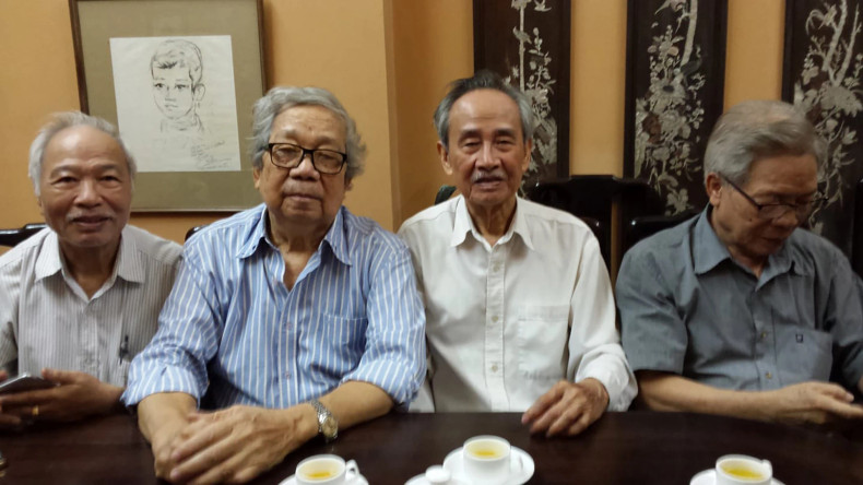 Dat (far left) and Tac (second from the right) reminisce.