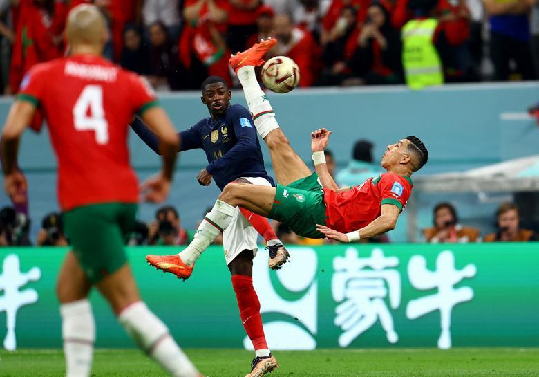 Morocco's Jawad El Yamiq shoots at goal with an overhead kick. (Photo: REUTERS)