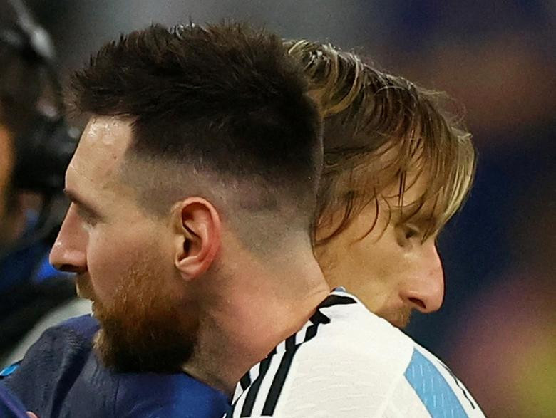 Argentina's Lionel Messi embraces Croatia's Luka Modric after the match as Argentina celebrate qualifying for the final. (Photo: REUTERS)
